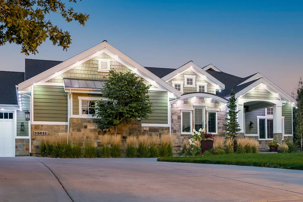 Craftsman-style home at dusk with soft white security downlights
